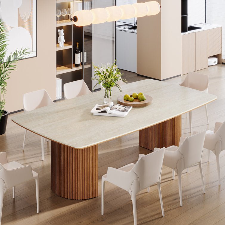 Modern travertine stone dining table paired with pure white chairs